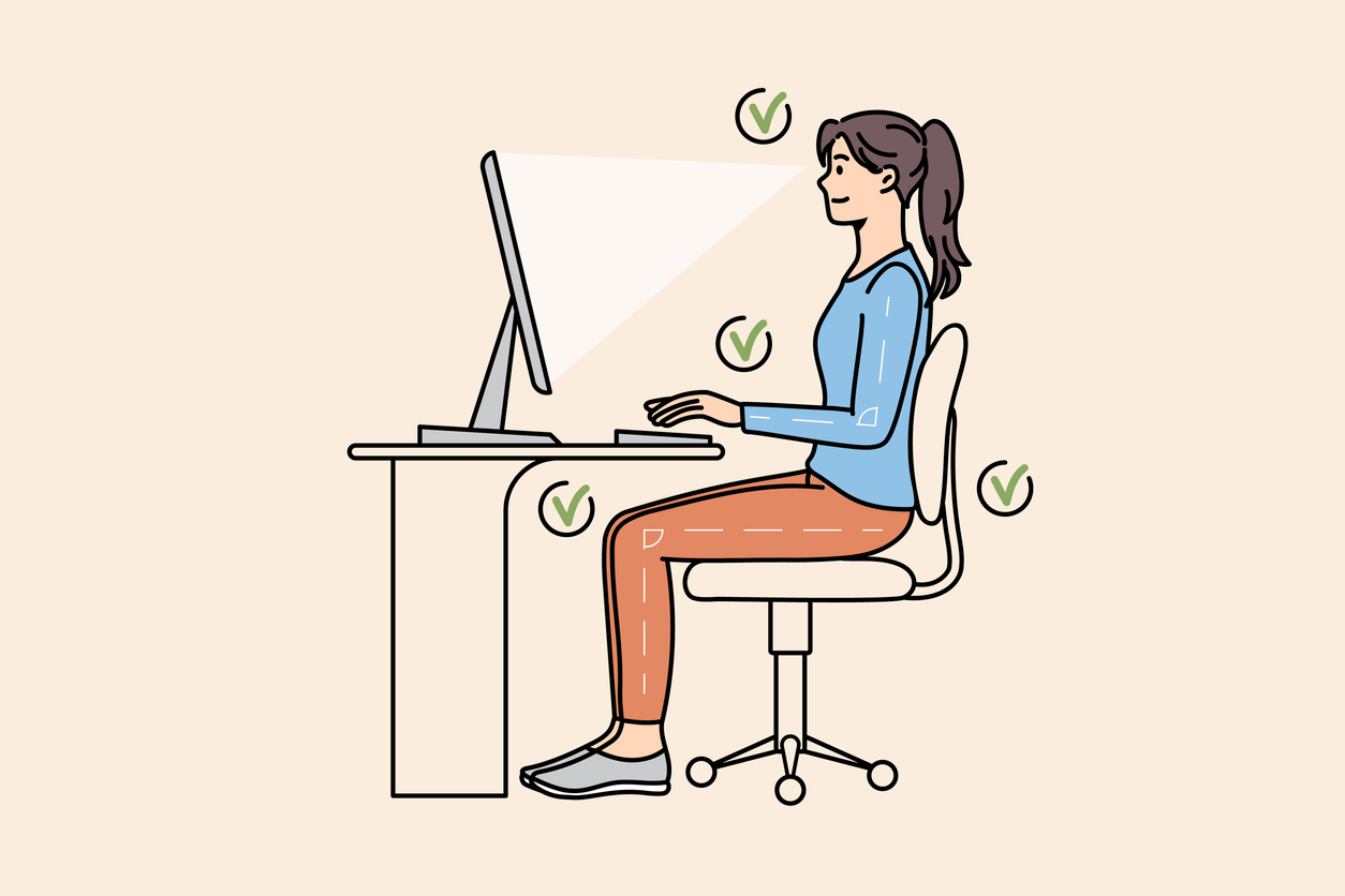 Person sitting ergonomically in chair, with legs and arms at 90 degree angle, and computer screen at an even/downward view
